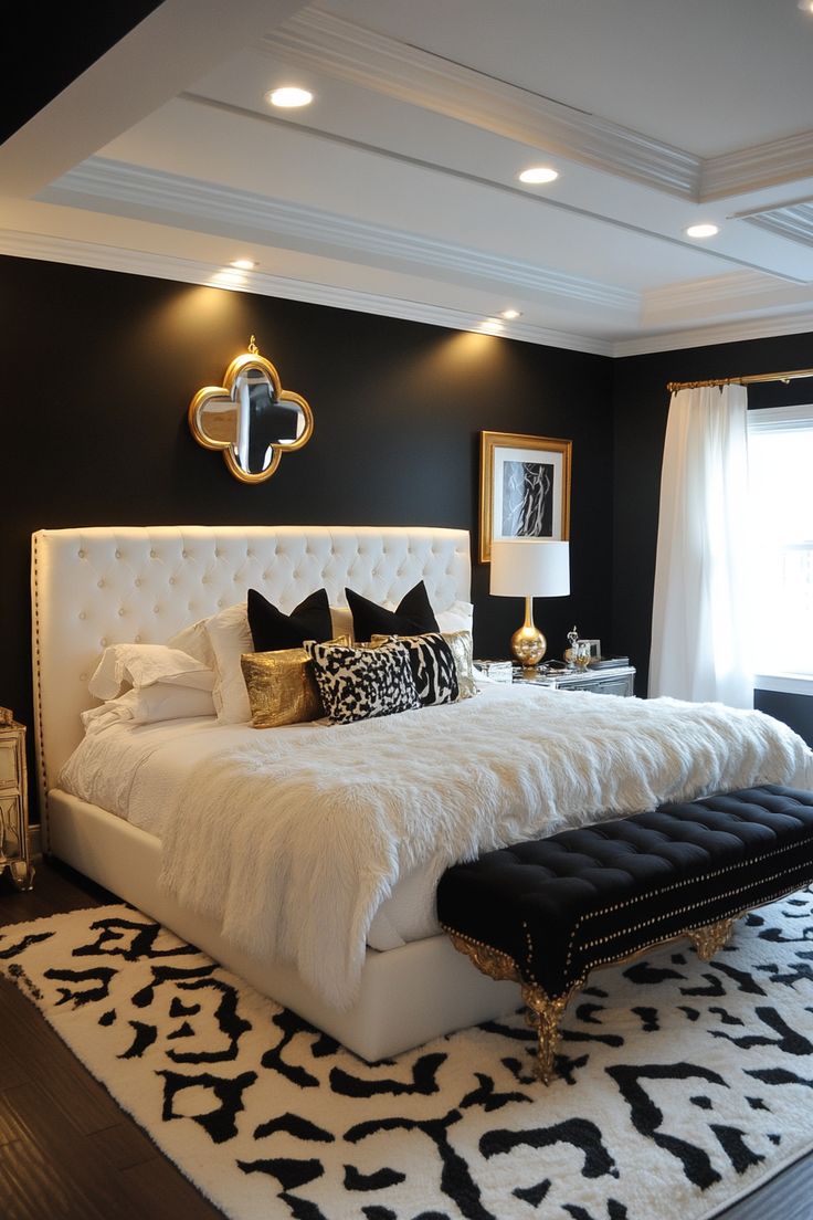 a large white bed sitting in a bedroom on top of a black and white rug