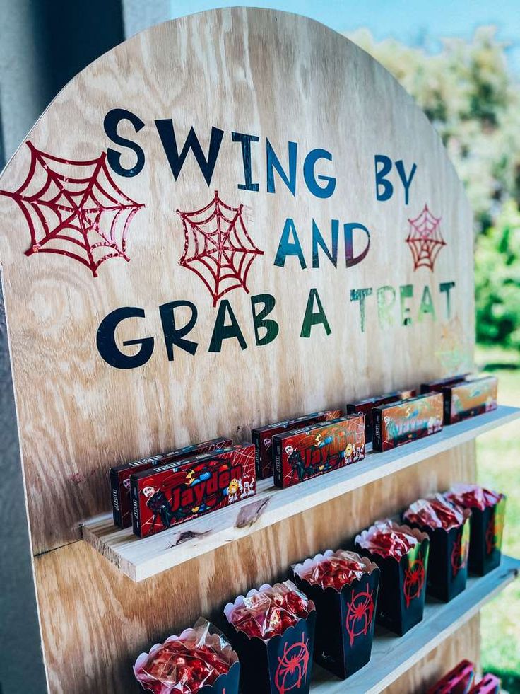 a wooden sign that says swing by and grab a treat on the side of it