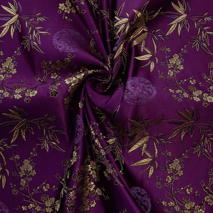 a purple and gold floral print fabric