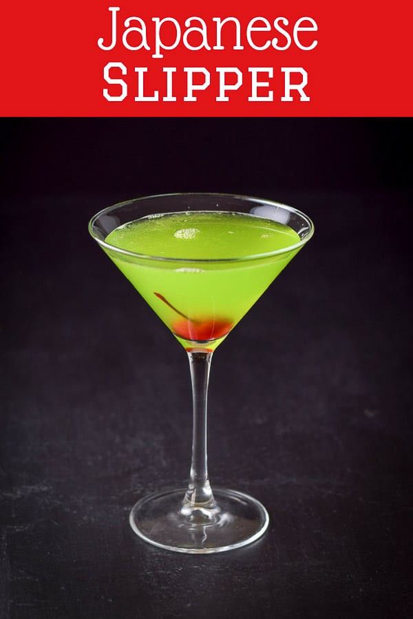 a green drink in a martini glass on a black background with the title japanese slipper