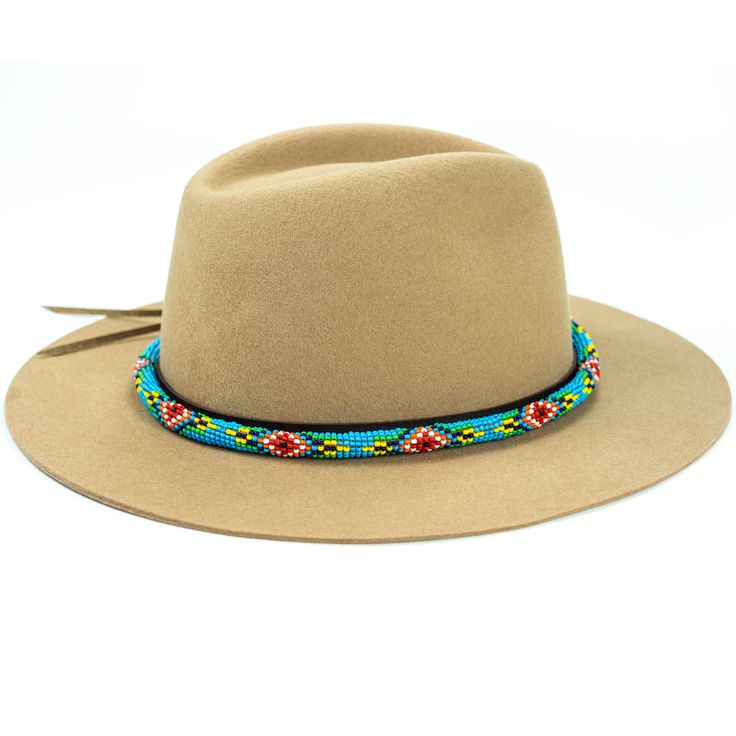 Price includes a Lola Sambboho hat & a Blue Vogue hatband. Save 10% with this bundle. Select hat size. Hatband is one size fits all. Hatband is removable. An iconic must-have Fedora hat that will never get out of fashion. Sambboho's Lola hat has a soft brim and indented crown. A chic piece to be worn at all seasons of the year. The timelessness chic and sophistication exuded by this hat make it a lifetime wardrobe investment you’ll never regret! Classic Fedora design in Sand color Trimmed wi Bohemian Sun Hat For Festival, Bohemian One Size Sun Hat For Festivals, Bohemian Style Festival Sun Hat, Bohemian Beige Felt Hat With Flat Brim, Southwestern Flat Brim Hat Bands For Vacation, Blue Festival Hat Band, One Size Fits Most, Blue Festival Hat Bands One Size Fits Most, Blue Festival Hat Band One Size Fits Most, Blue Festival Hat Bands One Size