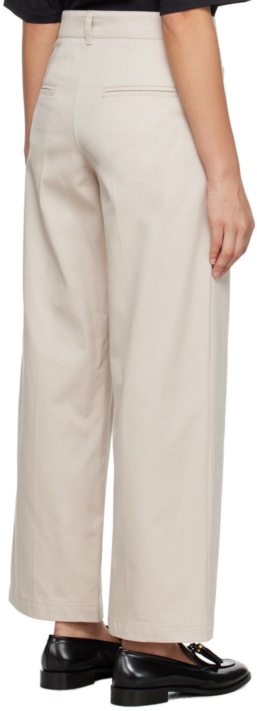 Cotton gabardine trousers. · Belt loops · Four-pocket styling · Zip-fly · Creased legs Supplier color: Ecru Cream Straight Pants With Welt Pockets, Cream Workwear Pants With Welt Pockets, Chic Beige Chinos For Work, Beige Wide-leg Dress Pants With Welt Pockets, Chic Beige Tapered Leg Chinos, Beige Wide-leg Dress Pants With Belt Loops, Cream Tapered Leg Bottoms For Workwear, Beige Tapered Leg Chinos For Work, Beige Ankle-length Chinos For Work