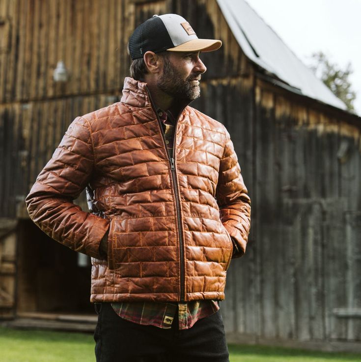 Embrace the spirit of adventure with the Teton Leather Jacket, a tribute to the rugged majesty of Wyoming’s Teton Mountain Range. Its rich, full-grain leather evokes the grandeur of these storied peaks, making a statement that is both daring and refined—striking the perfect balance between boldness and restraint. Crafted from premium full-grain sheep leather that develops a handsome patina with wear, the jacket features a modern brick-stitch pattern for a contemporary update. The lightweight dow Fall Outdoor Leather Jacket With Padded Collar, Brown Sport Coat For Winter Outdoor Activities, Fall Leather Jacket For Outdoor, Leather Jacket For Outdoor Fall Season, Fall Outdoor Leather Jacket, Winter Outdoor Leather Jacket, Winter Leather Jacket For Outdoor, Fall Outdoor Leather Outerwear, Rugged Brown Outerwear With Padded Collar