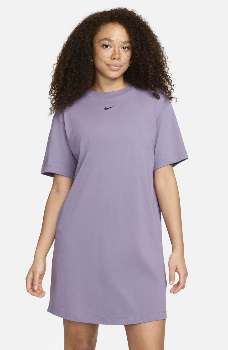 Take your athleisure game to the next level with a soft cotton jersey dress that feels like your favorite Nike T-shirt in a comfortably oversized fit. 34 1/2" length (size Medium) Crewneck Short sleeves Unlined 100% cotton Machine wash, tumble dry Imported Casual Solid Color T-shirt Dress For Loungewear, Casual Cotton T-shirt Dress With Relaxed Fit, Cotton T-shirt Dress For Everyday, Nike Sporty Loungewear T-shirt, Trendy Oversized Crew Neck T-shirt Dress, Casual Relaxed Fit T-shirt Dress For Everyday, Casual Everyday T-shirt Dress With Relaxed Fit, Casual Cotton T-shirt Dress, Casual T-shirt Dress With Relaxed Fit