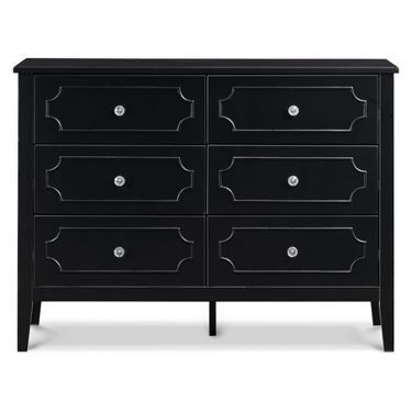 a black dresser with drawers and knobs on the top, in front of a white background