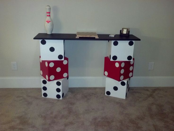 a table that has some kind of decoration on it with polka dots and a bowling ball