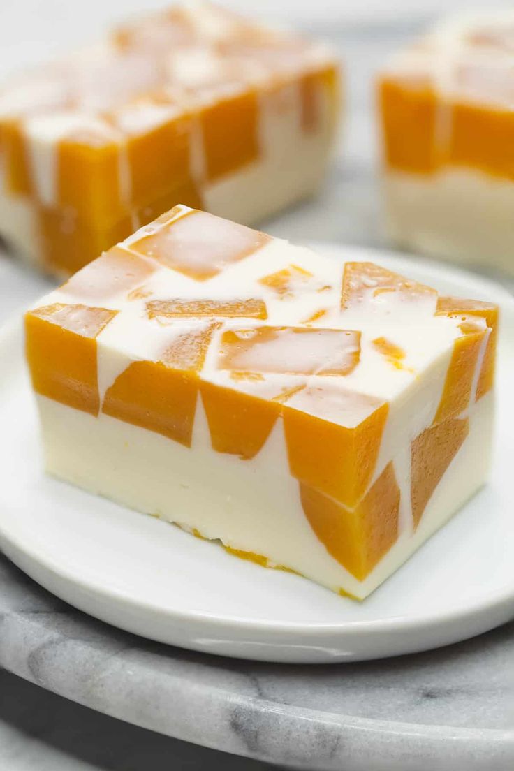 pieces of cake sitting on top of a white plate