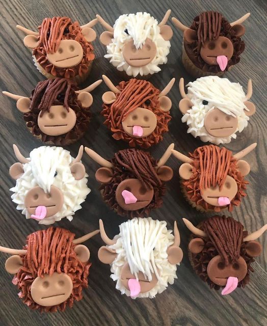 twelve cupcakes decorated to look like farm animals with long hair and pink noses