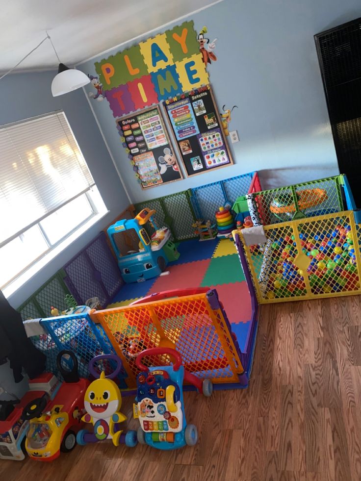 a child's play room with toys and games on the floor