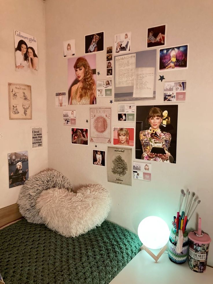 a room with a bed, desk and pictures on the wall