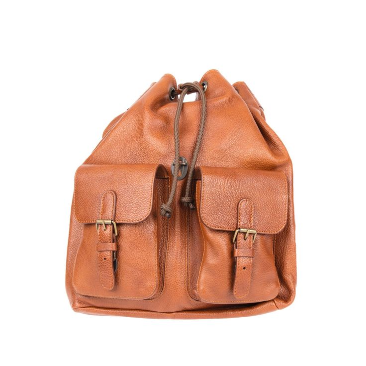 Practicality meets professional with Ruitertassen’s Pebbled Traveler Backpack in fine cognac leather. The large main compartment can hold everything from laptops and documents to some essentials for the weekend or the gym and closes with a pull cord. The zippered side compartment holds your phone or wallet and the elasticized inner pocket, key ring and pen loops, keep your keys and smaller items secured and neat. Its two outer front pockets are adjustable and close with small clasps hidden behin Luxury Leather Backpack For Travel In Cognac, Luxury Cognac Leather Backpack For Travel, Luxury Cognac Leather Travel Backpack, Brown Leather Backpack With Leather Trim For On-the-go, Travel Leather Backpack In Cognac With Leather Handles, Cognac Leather Backpack With Leather Handles For Travel, Leather Backpack With Leather Trim For Everyday, Modern Brown Leather Backpack For Everyday Carry, Modern Brown Leather Backpack For Everyday