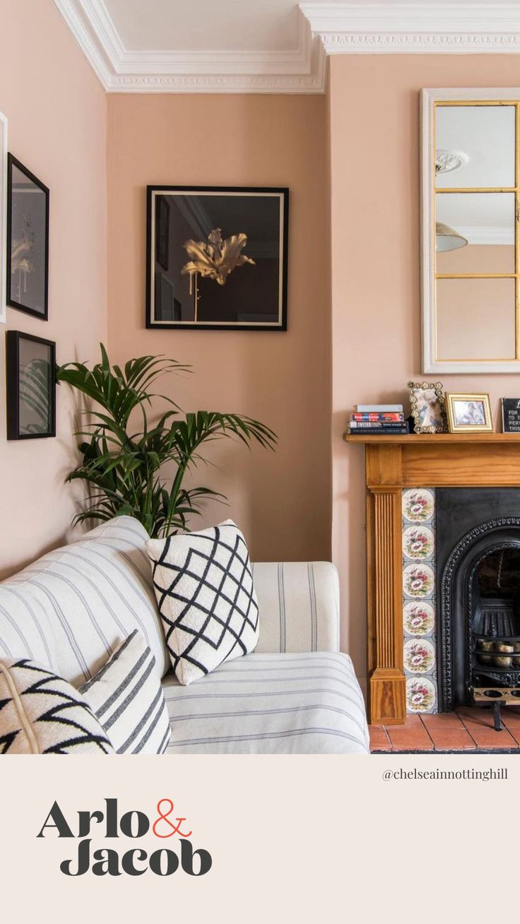 a living room filled with furniture and a fire place under a painting on the wall