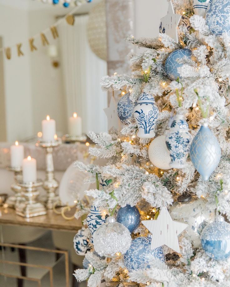 a decorated christmas tree with blue and white ornaments