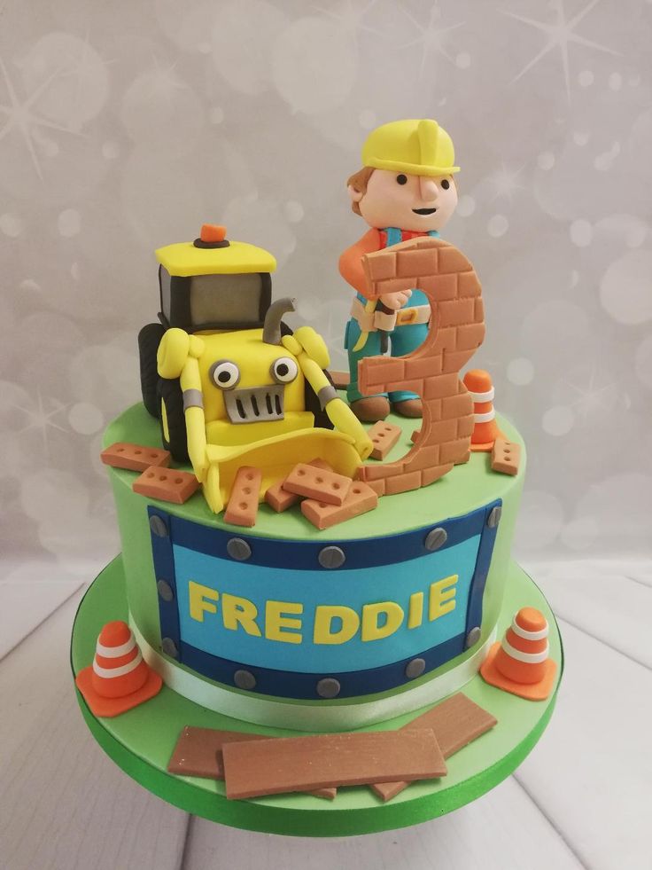 there is a cake with a construction theme on it