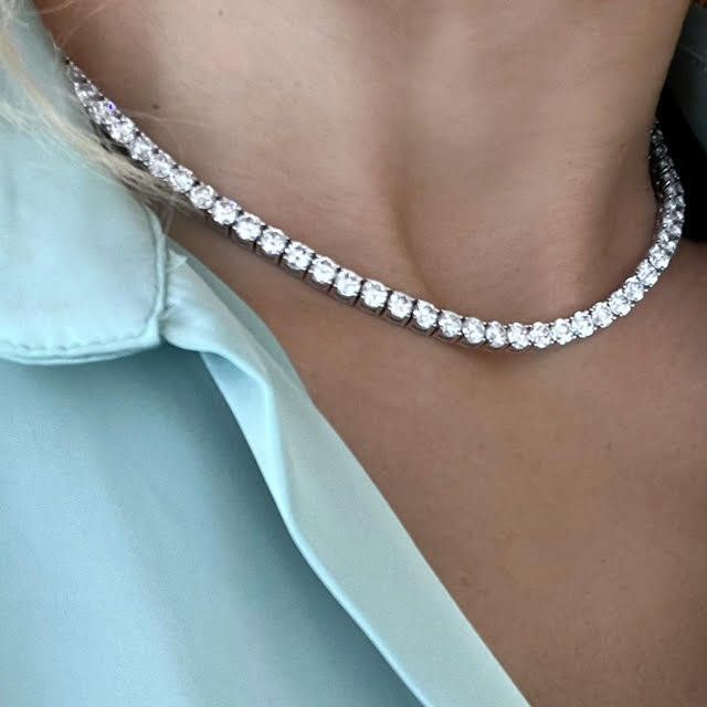 The most Incredible one! 30 Carat of top quality lab created diamond tennis necklace!  87 top quality, lab grown white diamonds, 4 prongs setting for each diamond, set as a tennis chain In 14k white gold.  Sits so perfect on a women neck, for a luxurious amazing look, that no one can miss! Double locking for extra safety. This tennis necklace will fit perfectly for the classic bride, special anniversary gift or round bday! Please contact us for size customization and gold color. Details: ⟡ 87 la Luxury Pave Setting Tennis Necklace For Formal Occasions, Luxury Classic Diamond Necklace With Lab Grown Diamond, Luxury Diamond Necklace With Satellite Chain, Luxury Exquisite Tennis Necklace With Prong Setting, Luxury White Gold Tennis Necklace With Lab Grown Diamonds, Luxury Baguette Cut Diamond Tennis Necklace, Luxury Silver Tennis Necklace With Pave Setting, Classic Diamond White Tennis Necklace Gift, Classic Diamond White Tennis Necklace As Gift