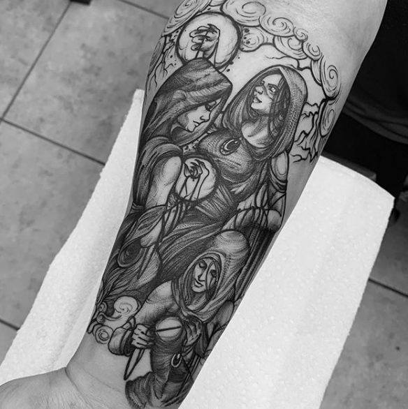 black and white tattoo on the arm of a woman with an angel above her head