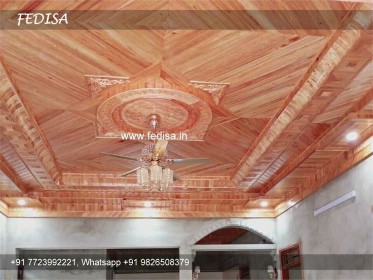 the ceiling is made from wood and has a chandelier