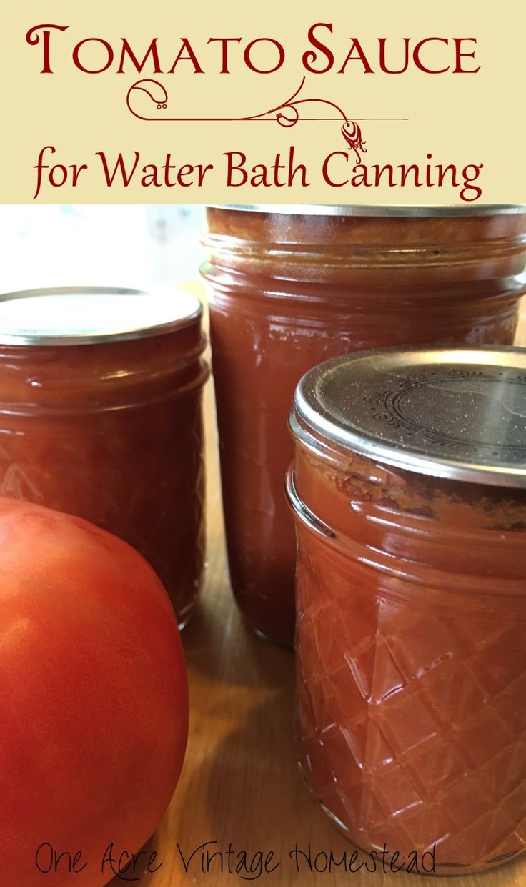 tomatoes and jars filled with water bath canning