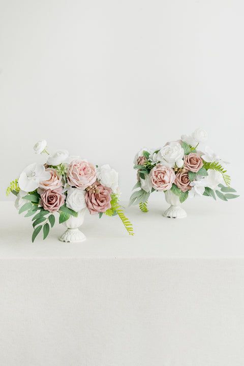 two white vases with pink and white flowers