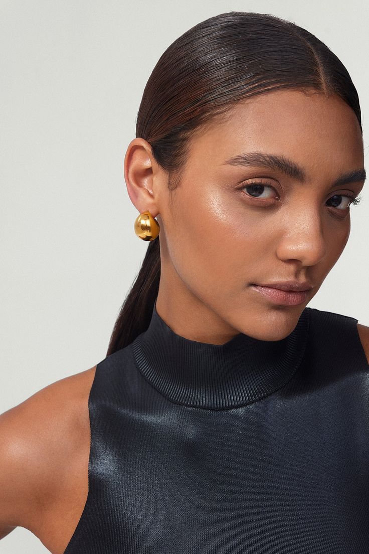 These gold chunky hoop earrings add a touch of chic to any look. Perfectly minimalistic, waterproof, and tarnish-free, these beauties make a great go-to statement earrings. Made of hollow + lightweight metal and dipped in thick gold plating, these earrings are perfect for everyday wear! ………………………………….D E T A I L S• Materials: Stainless steel, 18k gold plating• Hoop Diameter: 2.3cm (0.8 inches) • Hoop Width: 1.8cm (0.7 inch)• This product is hypoallergenic, waterproof and tarnish resistant Contemporary Fine Jewelry, Chunky Hoop Earrings, Modern Muse, Minimal Jewelry, Jewelry Branding, Gold Plating, Jewelry Care, Statement Earrings, Gold Earrings