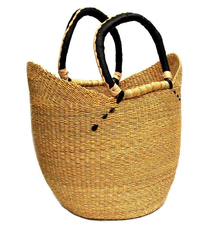 The U- shopper basket is the perfect tote, beach bag, shopper, everyday bag, or home decor basket. | The U- shopper basket is the perfect tote, beach bag, shopper, everyday bag, or home decor basket. The beautiful bolga baskets are hand- woven in small villages of Ghana, a tradition passed down from generation to generation. They are woven out of renewable resources, including banana leaf and elephant grass, which grow abundantly in the region. Each basket is hand woven and 100% unique! Colors w Shopping Basket Shoulder Bag With Leather Handles, Woven Bucket Bag For Shopping, Brown Beach Bag With Rolled Handles For Shopping, Market Tote Bucket Bag With Braided Handles, Natural Fiber Straw Bag With Rolled Handles For Shopping, Shopping Straw Bag With Rolled Handles, Bucket Bags With Braided Handles For Market, Market Bucket Bag With Braided Handles, Natural Basket Shoulder Bag For Market