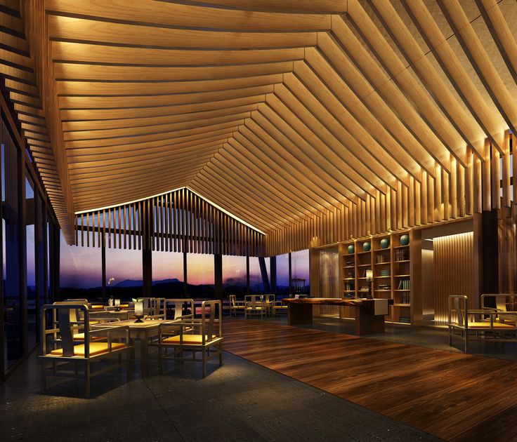 the inside of a restaurant with wooden tables and chairs at dusk, along with floor to ceiling windows