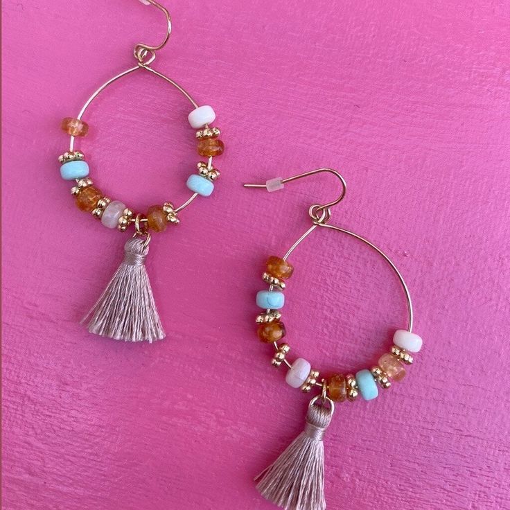 Elevate your summer style with our exquisite Coastal Rose Earrings, designed to bring a touch of coastal chic elegance to your look. These stunning statement earrings feature delicate pink beads and flowing fringe, perfect for any beach lover seeking a pop of color. Crafted with meticulous attention to detail, the Coastal Rose Earrings blend a radiant golden base with soft pink hues, capturing the essence of a beachy sunset. The pink beaded fringe sways gracefully, adding a playful yet sophistic Adjustable Beaded Earrings With Dangling Beads For Beach, Elegant Beaded Earrings For Summer Beach, Elegant Beaded Earrings For Beach Summer, Elegant Beaded Earrings For Beach In Summer, Round Beaded Earrings For Summer Vacation, Bohemian Beaded Dangling Earrings For Vacation, Trendy Colorful Beaded Earrings For Beach, Bohemian Dangle Tassel Earrings For Spring, Trendy Dangle Beaded Earrings For Vacation