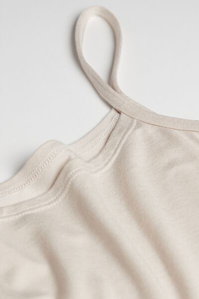 Soft modal top with spaghetti straps. May be worn front or back. 

The Green Collection is set apart by the use of fiber with a low environmental impact like, for example, modal by Lenzing, a plant-based fabric derived from renewable and sustainable sources. Modal Tops With Built-in Bra For Loungewear, Beige Cotton Tank Top With Built-in Bra, Beige Tank Top With Built-in Bra For Loungewear, Modal Tops With Built-in Bra And Scoop Neck, Modal Scoop Neck Top With Built-in Bra, Casual Top With Delicate Straps And Scoop Neck, Loungewear Tops With Delicate Tank Straps, Casual Tops With Delicate Straps For Loungewear, Cotton Tank Top With Delicate Straps