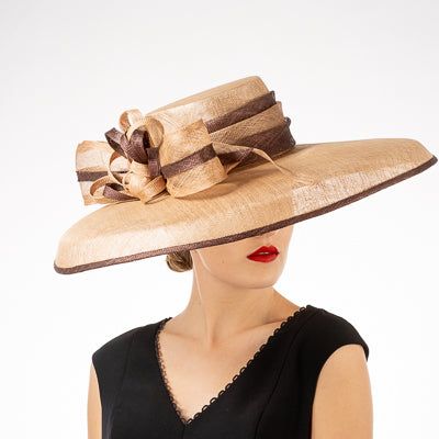 Sophisticated ladies Kentucky Derby hat in neutral tan. This beautiful hat will complement almost any outfit. Also available in pink. Elegant Brown Fitted Sun Hat, Elegant Fitted Brown Sun Hat, Formal Brimmed Fedora, Elegant Flat Brim Fedora For Spring, Chic Fitted Fedora Hat, Summer Sun Hat With Structured Crown, Elegant Adjustable Beige Straw Hat, Elegant Beige Curved Brim Fascinator, Chic Fitted Brimmed Hat