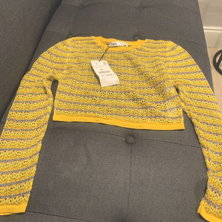 Knit Long Sleeve Crop Top Yellow Long Sleeve Spring Sweater, Yellow Fitted Knit Sweater, Stretch Yellow Knit Top, Fitted Yellow Knit Sweater, Trendy Yellow Stretch Sweater, Chic Yellow Winter Top, Yellow Knitted Crew Neck Top, Casual Yellow Crochet Sweater, Yellow Pointelle Knit Sweater For Winter