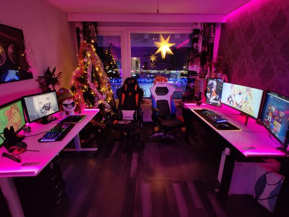 a room filled with computer monitors and desks