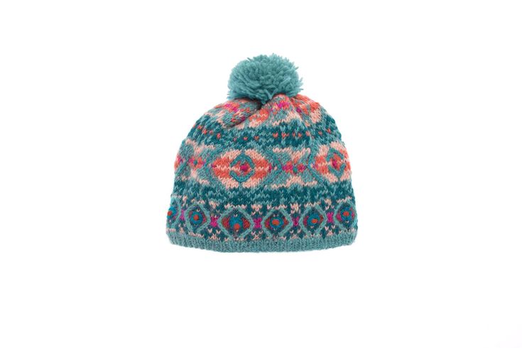 A fun pattern-filled hat made with 100% wool. This is a multicolored addition to any snow day. Fleece lined and handmade in Nepal. Hygge Fashion, Hat French, French Knots, Knit Hats, French Knot, Snow Day, Hat Making, Winter Style, Cool Patterns