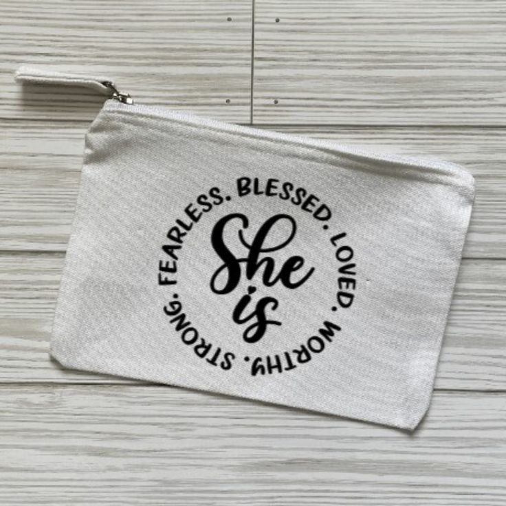 a white zipper bag with the words fearless, blessed and she is fabulous on it