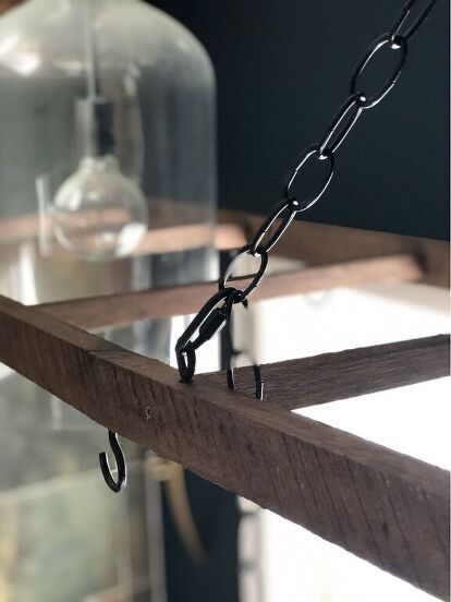 a metal chain hanging from the side of a wooden shelf