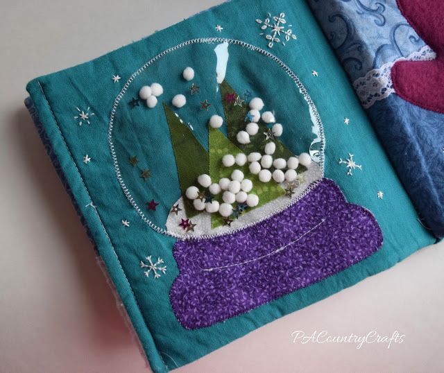 a close up of a piece of cloth with buttons on it and snowflakes in the background