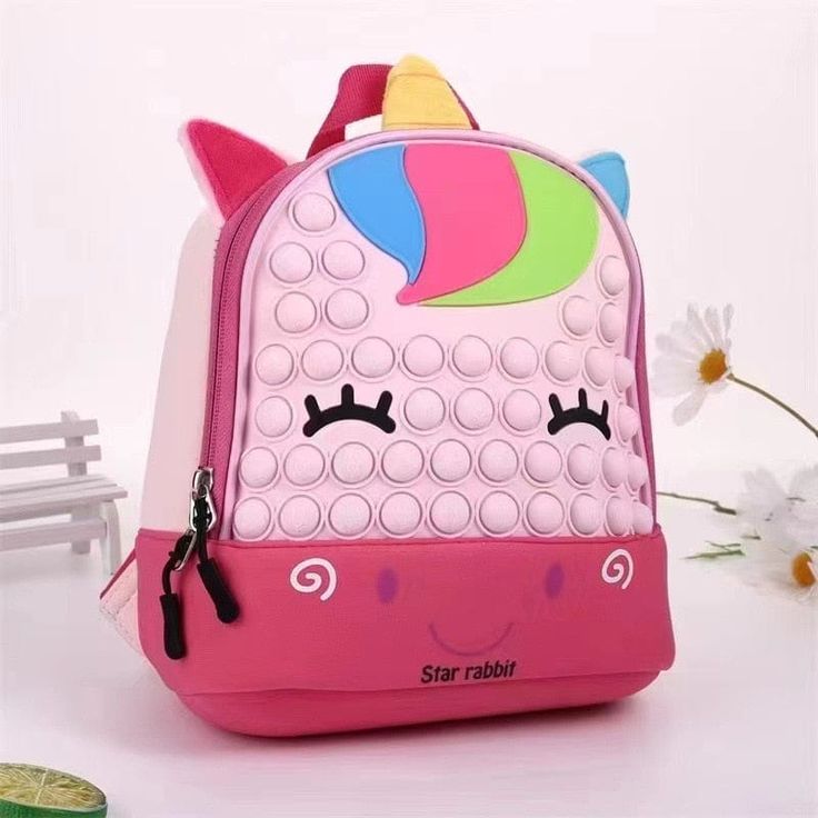 Introducing our whimsical "Cartoon Animal Pop It Backpack" collection - a delightful fusion of charm, functionality, and endless fun for your little one! 🎒🐮🦆🦄🐘 These backpacks are more than just bags; they're your child's playful companions for everyday adventures. Each featuring a cartoon cow, duck, unicorn, or elephant, their irresistibly cute faces and fluffy ears are designed to bring joy wherever they go. Crafted with care, these backpacks boast thick padded straps that ensure maximum Cute School Backpack With Animal Design, Cartoon-style School Bags With Animal Design, Cartoon Style School Bags With Animal Design, Cartoon Animal Design School Bags, Cartoon Style Animal Design School Bag, Cartoon Pink Backpack For Daily Use, Pink Cartoon Backpack For Daily Use, Cartoon Style Pink Backpack For Daily Use, Pink Cartoon Backpack For Travel