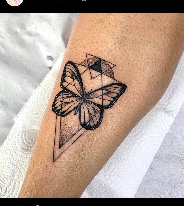 a black and white tattoo with a butterfly on the left side of the arm,