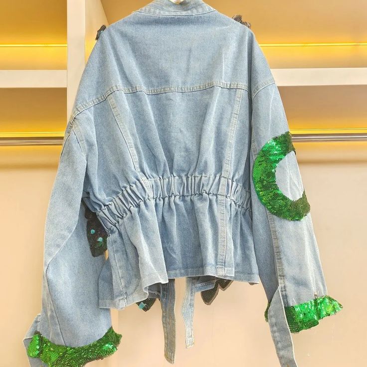 This V-neck denim jacket features stunning 3D peacock sequined embroidery, adding a touch of elegance and sophistication to your wardrobe. The intricate design and detailed craftsmanship make this jacket a statement piece that will elevate any outfit. - Color: Green- Style: Jacket- Sleeve Length: Long Sleeve- Fabric: Denim- Closure Type: Button- Details: Embroidery, Sequins- Occasion: Casual- Gender: Women- Size: S, M, L, XL, 2XL, 3XL, 4XLS: Suitable for weight: 45-50kg;M: Suitable for weight: 5 Casual Long Sleeve Denim Jacket With Sequins, Spring Denim Jacket With Sequins Long Sleeve, Spring Denim Jacket With Sequins And Long Sleeves, Spring Sequined Long Sleeve Denim Jacket, Spring Denim Jacket With Sequins, Sequin Denim Jacket For Spring, Long Sleeve Denim Outerwear With Sequins, Denim Long Sleeve Outerwear With Sequins, Denim Sequined Long Sleeve Outerwear