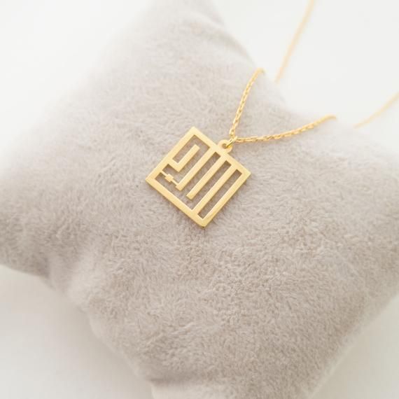 This necklace is a piece of our new collection of Allah necklace made from sterling silver and 14k gold. The collection includes different designs that suit all tastes Kufi/calligraphy, heart/rectangle/triangle shapes, tiny/big sizes. Here is the link for the full collection: https://etsy.me/2Swd0lPAll the designs can be made as necklace, bracelet, and earrings. If you also want a complete set that includes a necklace, a bracelet and earrings please get in touch with us. We accept custom orders! Gold Rectangular Pendant Jewelry For Gift, Silver Square Pendant Necklace In 14k Gold, Gold Necklace With Square Pendant For Anniversary, Gold Square Pendant Jewelry For Mother's Day, Gold Sterling Silver Jewelry With Rectangular Pendant, Fine Jewelry Rectangular Pendant As Gift, Silver 14k Gold Square Pendant Necklace, Elegant Name Necklace With Rectangular Pendant, Elegant Rectangular Pendant Name Necklace As Gift