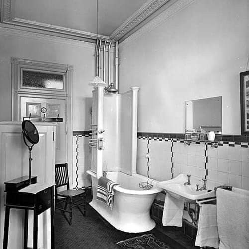 an old fashioned bathroom is shown in black and white