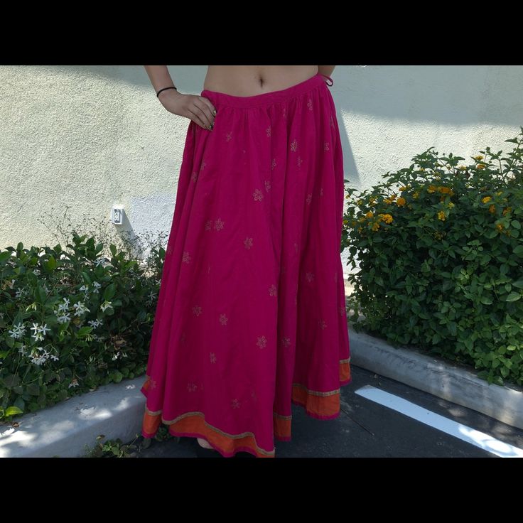 Designer. Unique Skirt For Women Of Today Add Class And Elegance. Stand Out In This Pink/Orange Long Skirt, Gold Details Overall, Pure Cotton Fabric For That Breathable Comfort . Wear It With Crop Tops, Bodysuits And Go On A New Adventure ! It Will Never Go Out Of Style. Size Fits Small To Large With The Tie String ! Bohemian Maxi Skirt For Summer Festivals, Bohemian Maxi Skirt For Festive Occasions, Flowy Skirt For Festive Summer Events, Bollywood Style Long Skirt For Summer, Festive Flared Skirt For Summer, Bohemian Long Skirt For Navratri, Festive Bohemian Flared Skirt, Festive Tiered Skirt For Summer, Summer Bohemian Long Skirt Lehenga