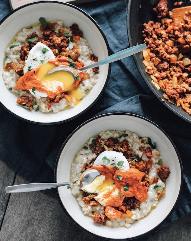 three bowls filled with food sitting on top of a table