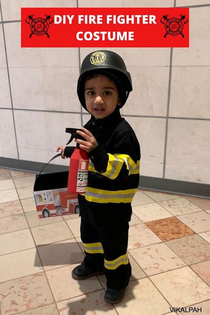 a young boy dressed as a fire fighter