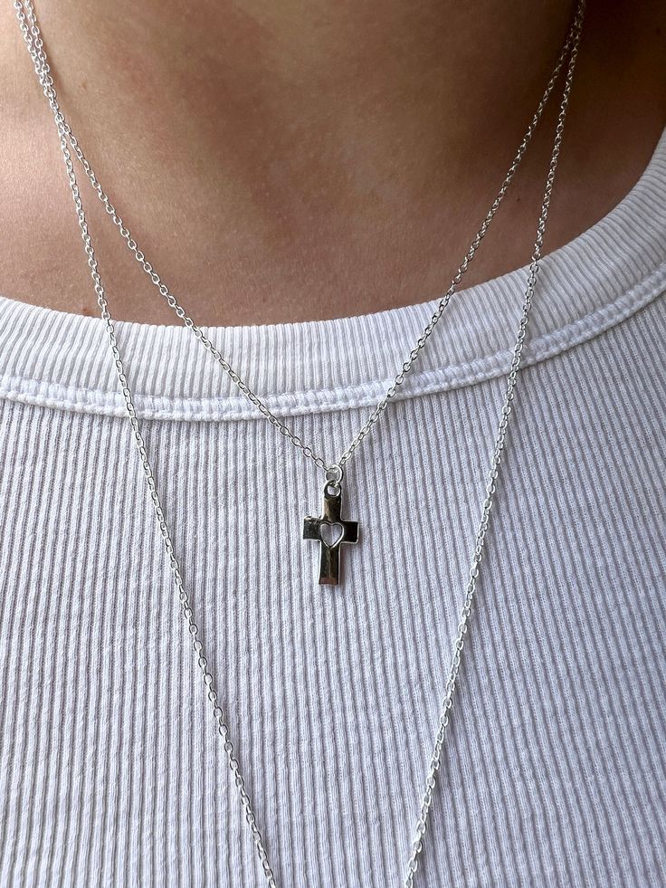 Embrace the timeless elegance and spiritual significance of our small silver cross  necklace. Meticulously crafted for both style and sentiment, this dainty necklace is the perfect accessory for everyday wear or special occasions. Product Features: 🌟Elegant Design: The cross pendant, a universal symbol of faith and hope, is elegantly crafted in high-quality plated sterling silver. The sleek and minimalist design ensures it complements any outfit, from casual to formal. 🌟 Perfect Length: The pendant is suspended on an 18'' sterling silver chain, providing a flattering length that sits gracefully on the collarbone. This versatile length is ideal for layering with other necklaces or wearing on its own. 🌟 Quality Material: Made from sterling silver plated chain, this necklace is hypoallerge Minimalist Hypoallergenic Cross Jewelry, Minimalist Cross Necklace For Everyday, Everyday Cross Pendant Charm Necklace, Minimalist Cross Pendant Necklace For Everyday, Minimalist Cross Pendant Necklace For Everyday Wear, Everyday Cross Charm Necklace With Clavicle Chain, Everyday Minimalist Cross Pendant Necklace, Simple Everyday Cross Jewelry, Minimalist Daily Wear Cross Pendant Necklace