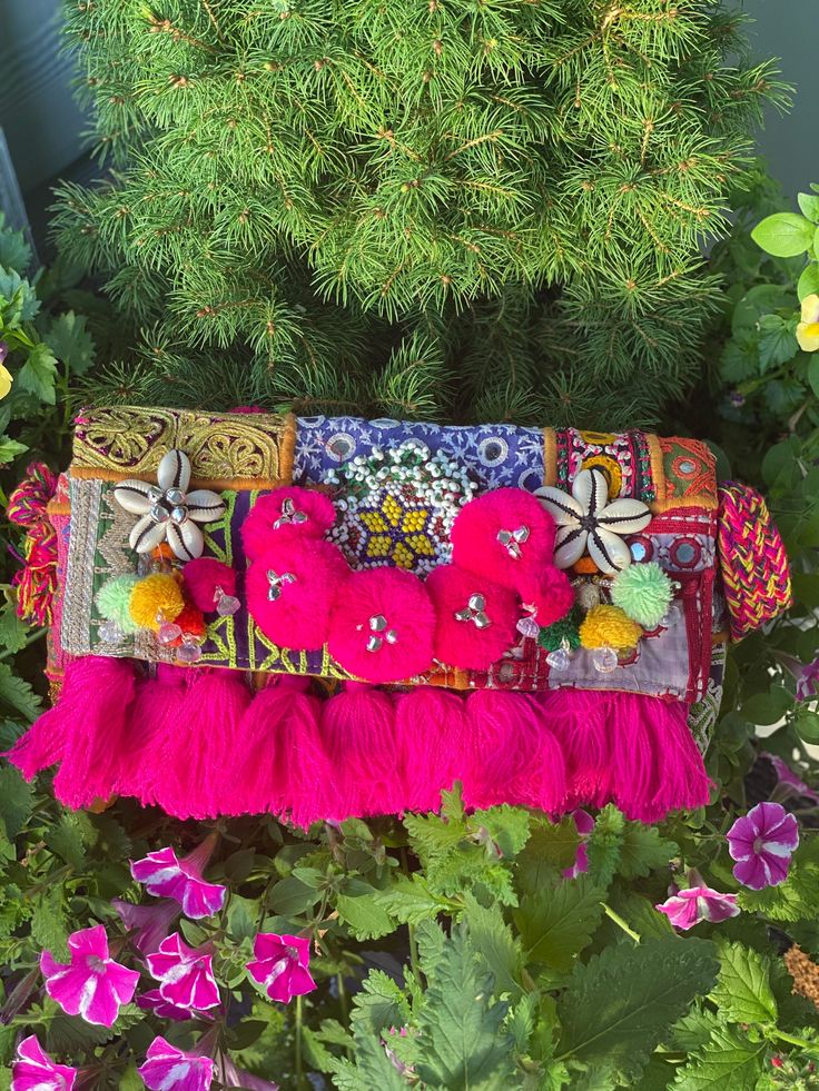 This colourful statement trendy bag is so gorgeous that you simple outfit will look outstanding.  This bag is handmade in india (jaipur). Every piece will be different because it's made with different fabric and textiles by hand not with machine. Each bag is bully lined , has a zipper inside and on top. Beautiful pompom and treads are attached to the purse.  Since these are handmade and made with vintage fabric and patches, there will be imperfections like broken shells which adds to the charm a Bohemian Clutch Bag With Tassels, Bohemian Tassel Clutch Bag, Bohemian Pouch Bag For Festival, Bohemian Festival Pouch Bag, Bohemian Rectangular Clutch With Tassels, Bohemian Tassel Clutch Shoulder Bag, Bohemian Clutch Shoulder Bag With Tassels, Handmade Summer Festival Clutch, Bohemian Rectangular Bag With Tassels