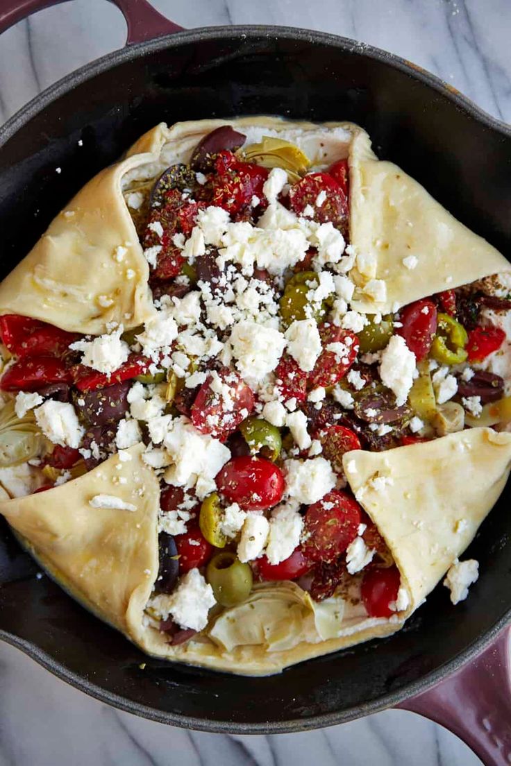 a pita filled with vegetables and feta cheese