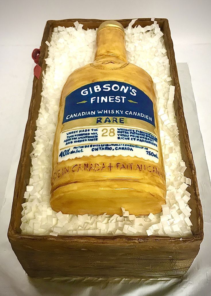 a cake made to look like a bottle of ginsen's finest whiskey on display