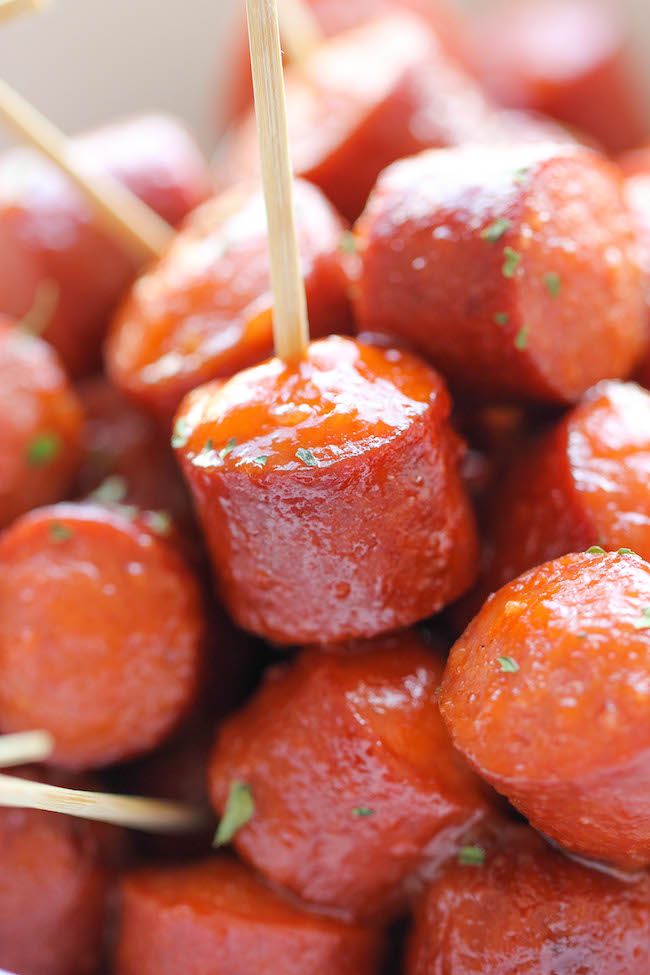 small skewers filled with meat sitting on top of each other