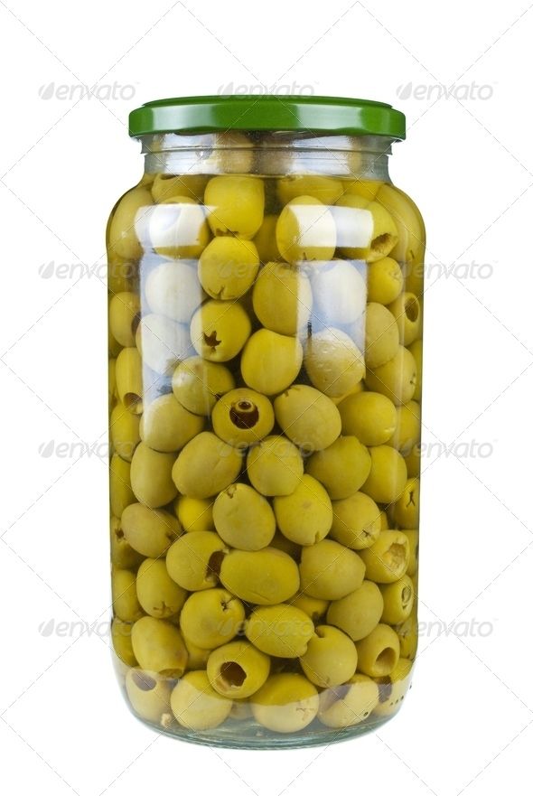 a glass jar filled with yellow olives