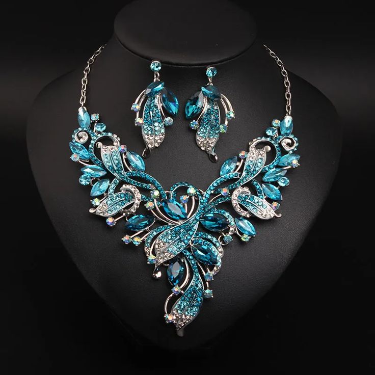 Whether you are the bride to be, or a bridesmaids, or the mother of the bride, this Bridal Jewelry is
perfect for just about anyone! Blue Crystal Jewelry Sets For Wedding, Glamorous Elegant Jewelry Sets For Wedding, Blue Wedding Jewelry With Matching Earrings, Glamorous Elegant Wedding Jewelry, Blue Jewelry Sets For Wedding, Silver Jewelry Sets For Mother Of The Bride, Elegant Bridal Necklace With Matching Earrings For Party, Silver Bridal Sets With Matching Earrings For Wedding, Glamorous Wedding Jewelry